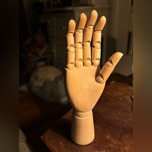 Wooden Hand sculpture with moveable fingers and wrist.